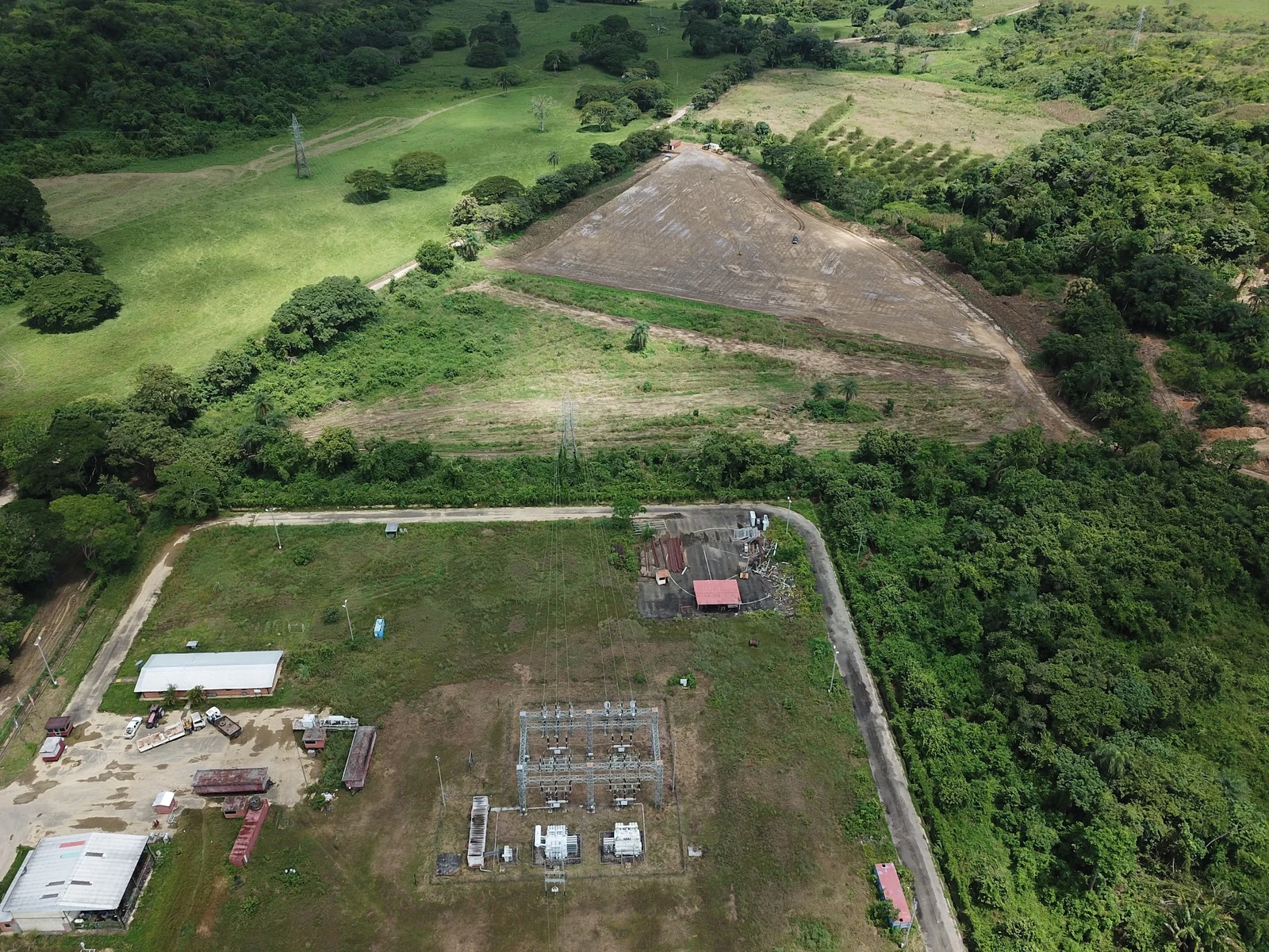 Aerial view of electrical infrastructure and its surroundings.